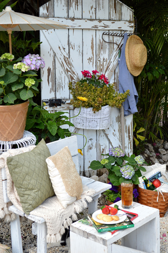Flea Market Decoration This old garden door creates a charming backdrop for this restful sitting area in the garden