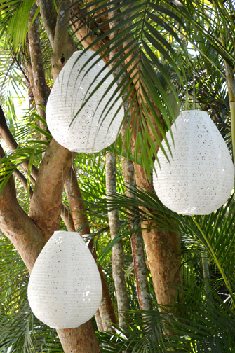 Rice-paper Lanterns Rice-paper lanterns sway in the trees and filter light through the eyelet cutout designs