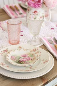 antique rose patterned china table display with pink and crystal glassware