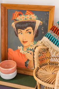A paint-by-number portrait with two Russel Wright tea cups