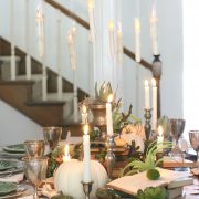 Candles floating over the elegant halloween tablescape add to the magic and mystery of the setting.
