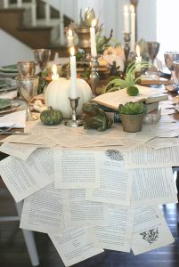 Book pages make a magical table runner for elegant Halloween table decor.