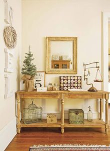 Blond wood entry table styled for Christmas
