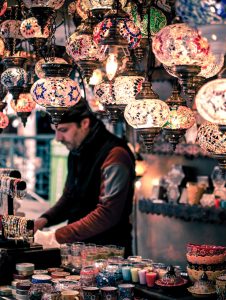 flea market negotiation vendor selling lights and jewelry