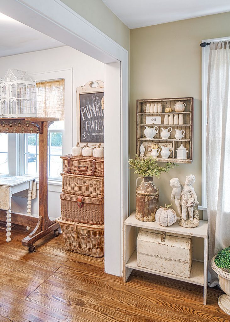 Living room vignette in fall farmhouse with flea market collectibles