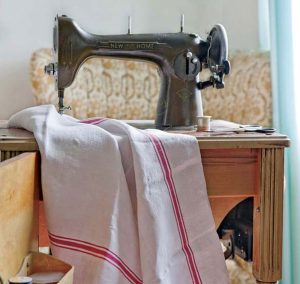 Antique grain sack with antique sewing machine