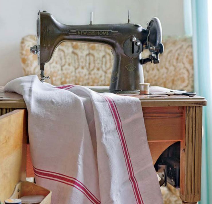 Antique grain sack with antique sewing machine