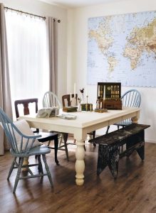 white table and mismatched chairs in sun drenched family room