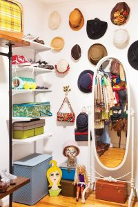 Closet with hats hung on the wall