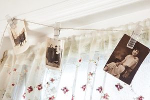 Black and white photos clipped to a string as bunting