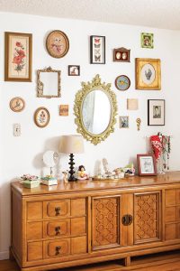 Gallery wall display over a Mid Century Modern lowboy dresser
