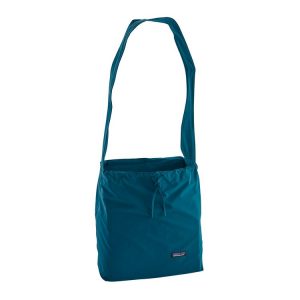 This dark teal, lightweight shoulder bag has a cinched top to keep larger flea market finds in.