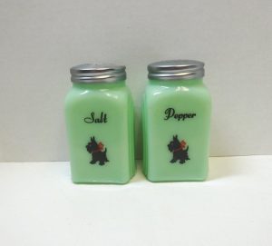 These green Jadite salt and pepper shakers are labeled with elegant black script and black and red Scottie dog decals.