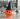 A vintage Halloween plastic jack-o-lantern wearing a black witch hat.