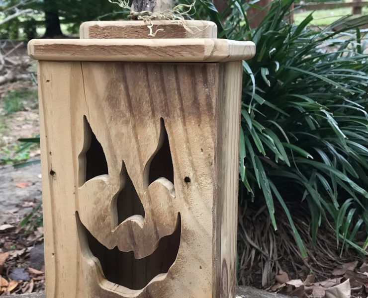 This rectangular, wood jack-o-lantern is made from reclaimed wood.