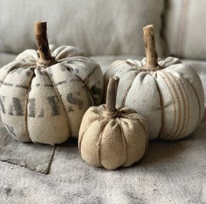 These faux pumpkins are made out of vintage sacks, twine and real wood for stems.
