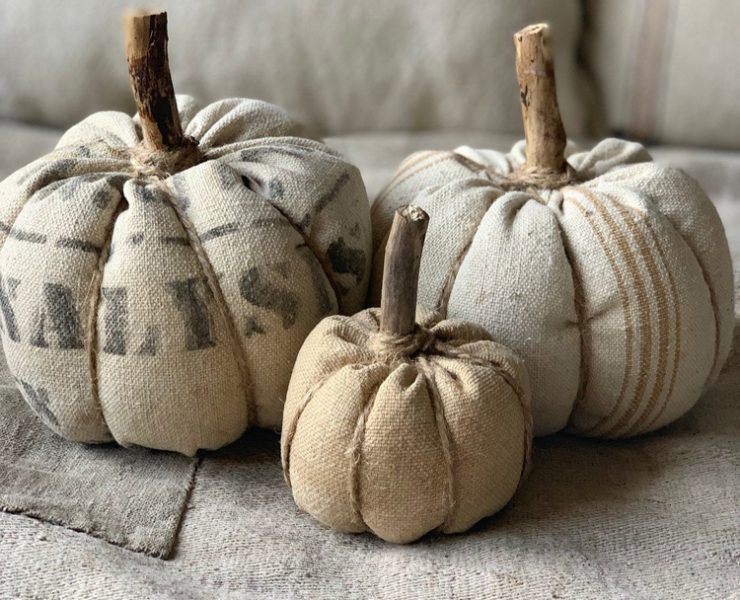 These faux pumpkins are made out of vintage sacks, twine and real wood for stems.