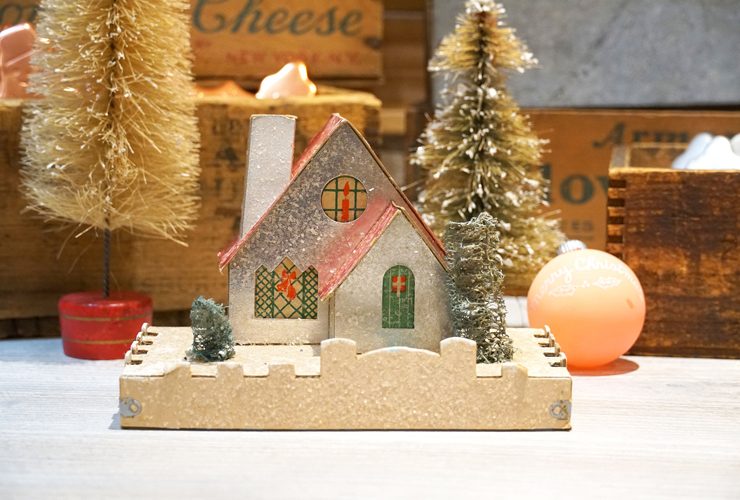 Putz house with a pink roof and silver glitter.