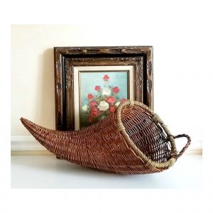 A vintage Thanksgiving wicker cornucopia.