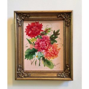 Small, ornate, gold frame with leafy pink flowers and a light pink background.