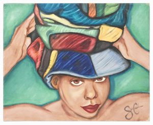 This vintage portrait is of an African american woman with bare shoulders donning a large, multi-colored, patched-up hat.
