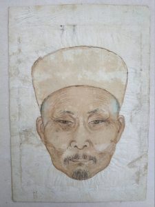 This vintage portrait is on aged, wrinkled paper and shows only the head and hat of an elderly Chinese man with a small mustache and goatee.