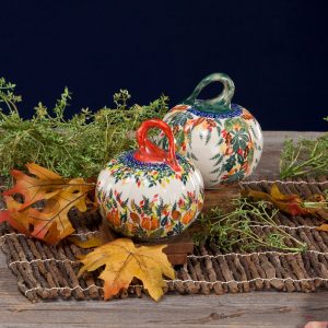 Each ceramic pumpkin is painted with pumpkins, acorns and leaves, as well as a traditional blue Polish pattern circling around the base of the stem.