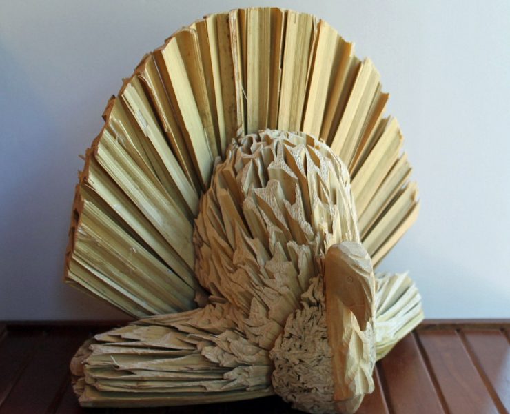 Vintage Thanksgiving turkey made out of dried cornhusks with a wooden head.