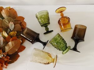 Vintage Thanksgiving colored-glass water goblets in different shapes and designs.