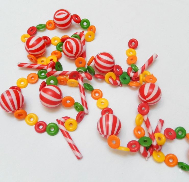 Vintage garland made out of plastic beads shaped like peppermints, candy canes and fruit loop cereal pieces.