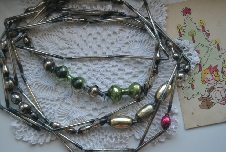 Vintage garland with metallic colors, mostly gray.