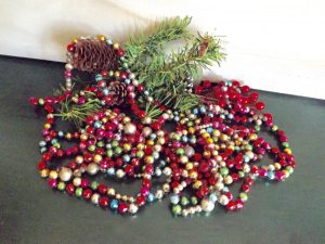 Vintage garland made out of colorful glass mercury glass beads.