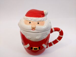 Santa mug with two parts. Santa's body is the cup and his head and hat make the lid.