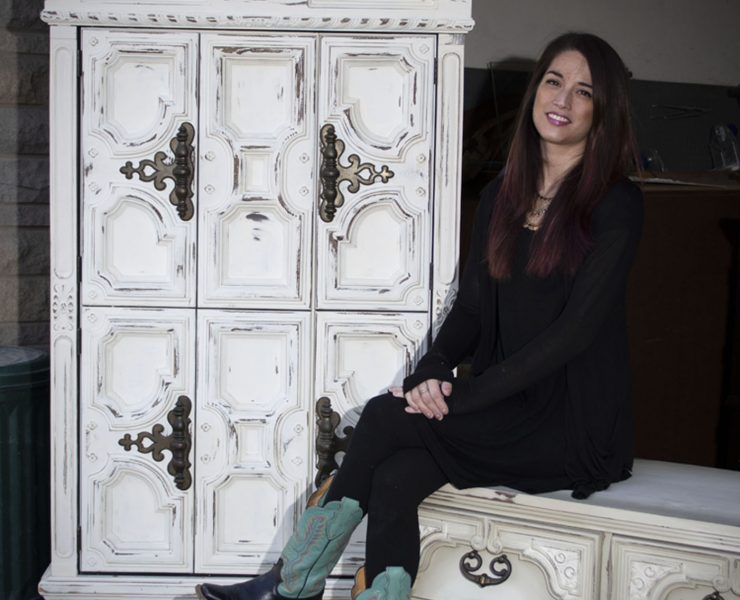 Photo portrait of CeCe Hunt in front of a CeCe Restyled creation.