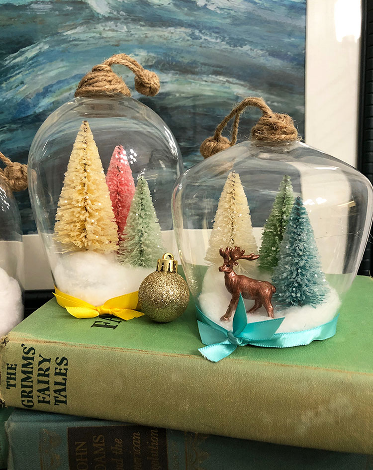 Wine glass cloche vignettes with glittered bottlebrush trees