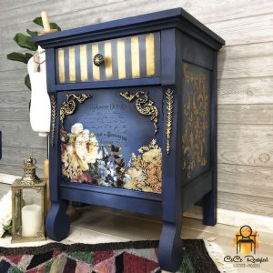 Dark blue side table with stripes and floral designs.