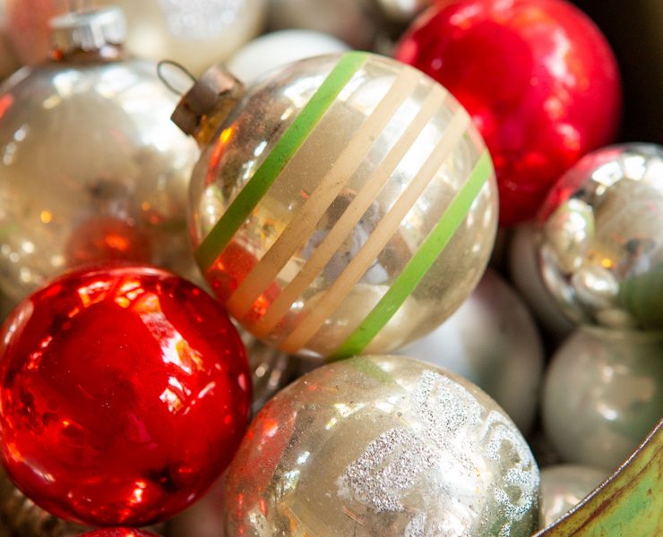 glass ornaments in a green vintage tin