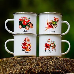 Metal Santa mugs with different vintage-inspired illustrations of Santa and personalized names on them.