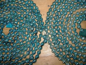 Vintage garlands made out of teal blue mercury beads.