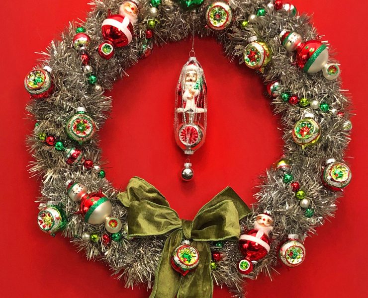 Vintage Inspired tinsel wreath with Shiny Brite ornaments against a red background