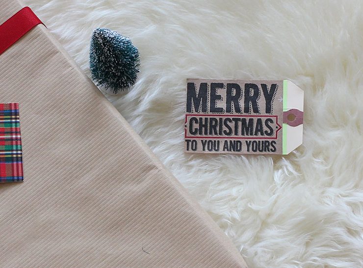 Upcycled holiday gift wrap with shopping bag.