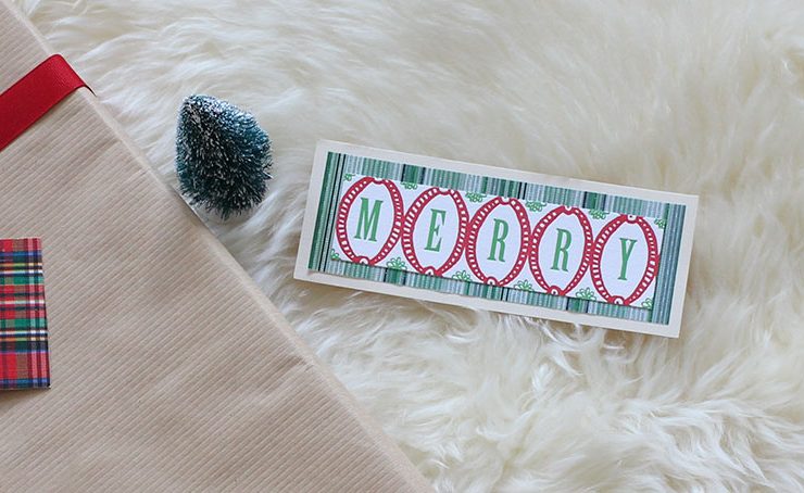 Upcycled holiday gift wrap with Merry text.