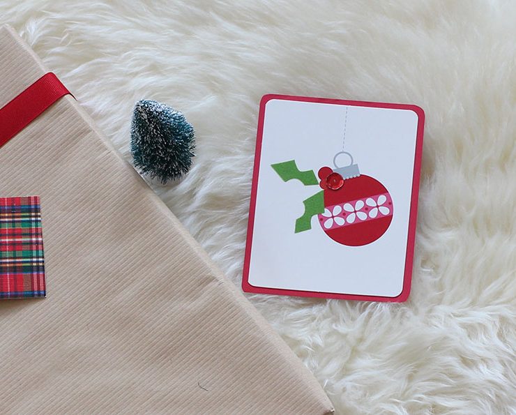 Upcycled holiday gift wrap with ornament card.