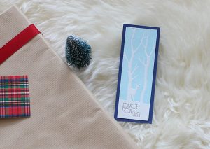Upcycled holiday gift wrap with winter deer card.