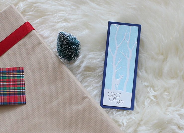 Upcycled holiday gift wrap with winter deer card.