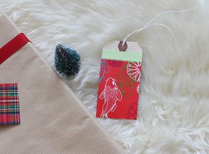 Upcycled holiday gift wrap with wrapping paper scrap..