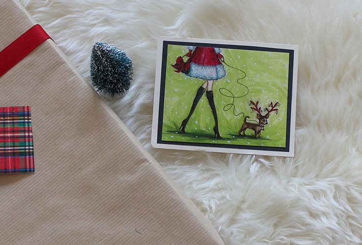 Upcycled holiday gift wrap with Christmas card..