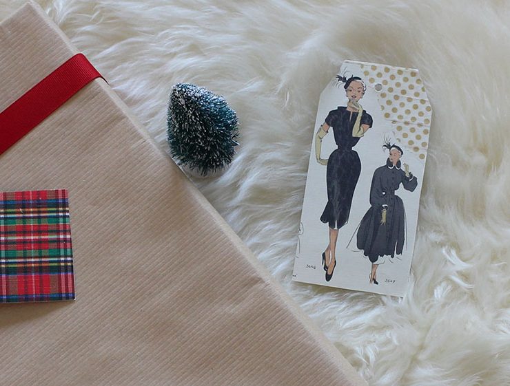 Upcycled holiday gift wrap with vintage fabric ad.