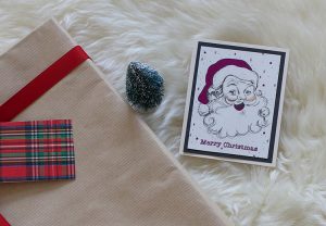 Upcycled holiday gift wrap with Santa card.