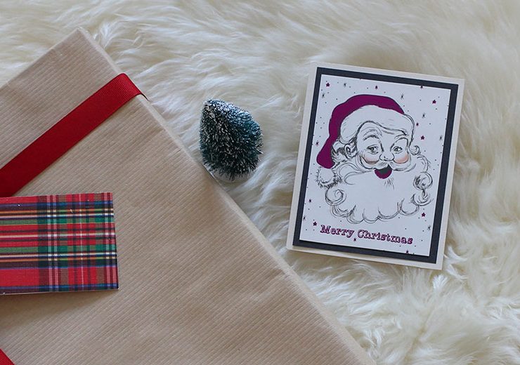 Upcycled holiday gift wrap with Santa card.